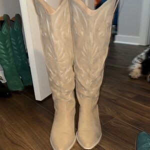 Arula knee high western Wide Calf boots.